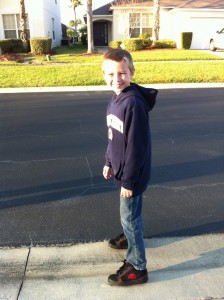 boy posing in Heelys shoes