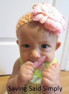 Baby smiling with Nuby teether