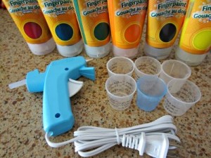 Plastic medicine cups and hot glue gun