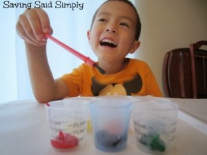 Boy painting with upcycled diy paint holder
