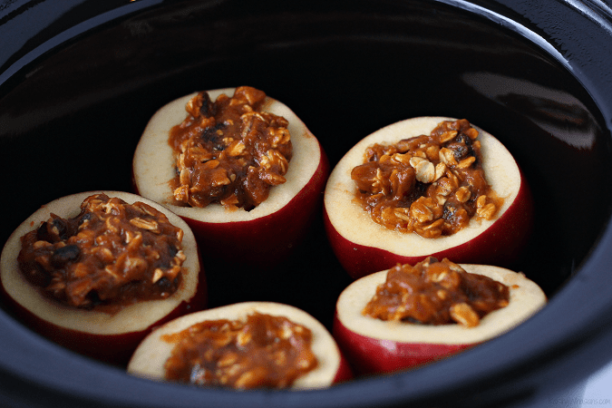 Easy fall pumpkin pie dessert with a healthy twist! No Guilt Slow Cooker Pumpkin Stuffed Apples Crock Pot Recipe is clean eating inspired & gives back - This slow cooker dessert is an easy make ahead recipe for any event. #Recipe #Dessert #SlowCooker 