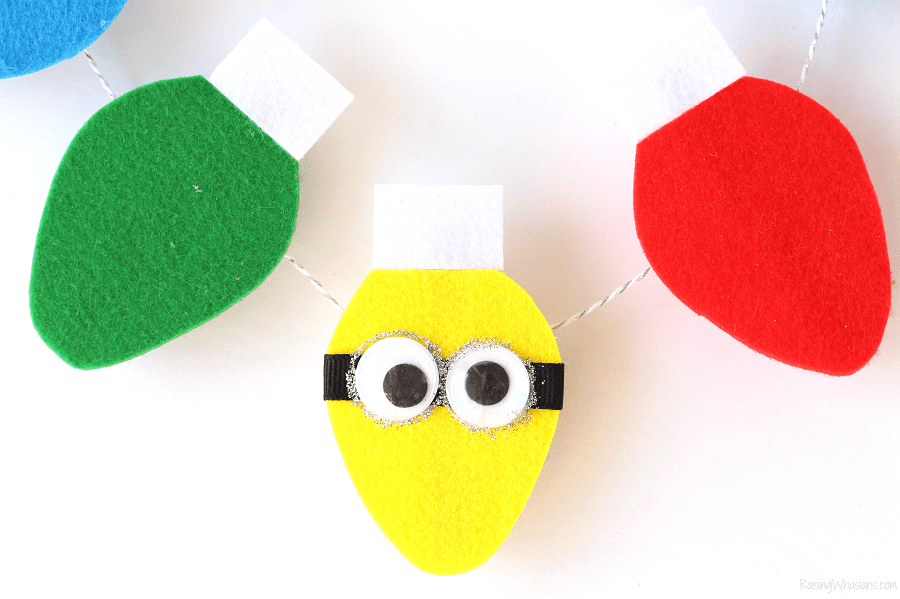 Festive DIY Minions Garland for a (NON) Despicable Christmas Card Display - Raising Whasians Despicable me garland craft