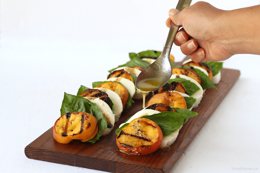 Grilled peach salad Grilled Peach Caprese Salad with Easy Key Lime Vinaigrette | Florida flavor inspired idea with homemade dressing. Made with a secret ingredient, FL peaches! #Recipe #Salad #HealthyRecipe
